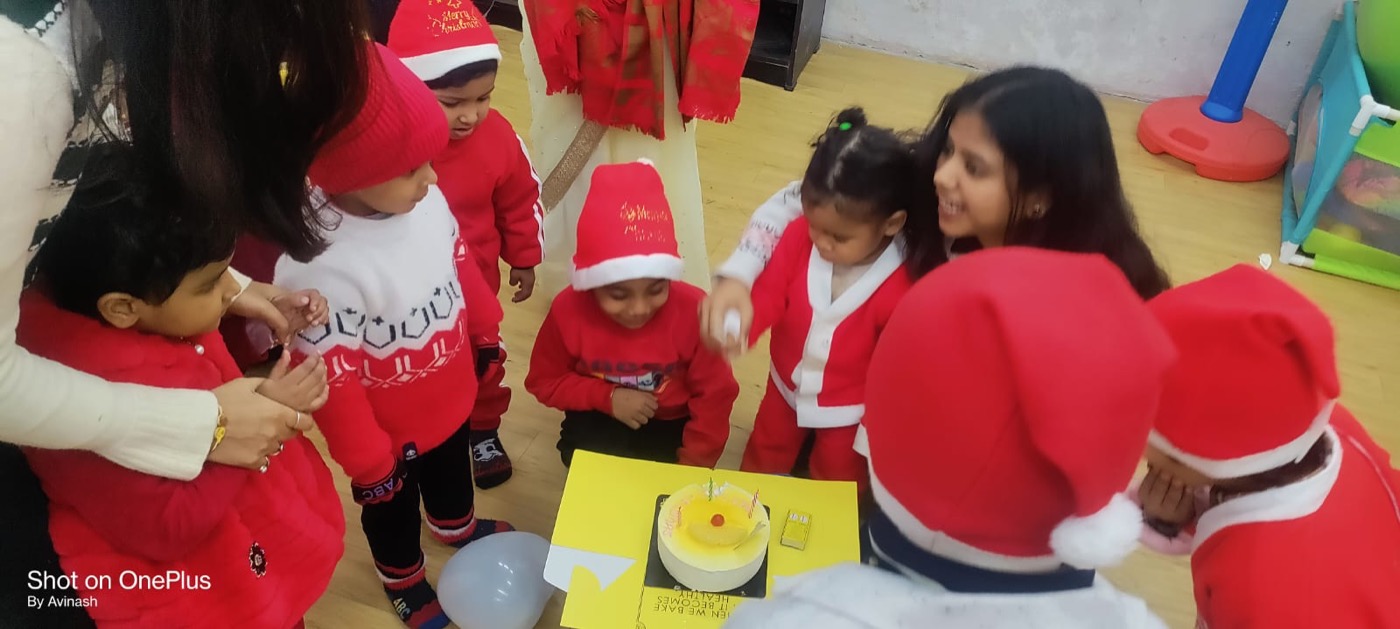 Children celebrating with a craft-decorated cake