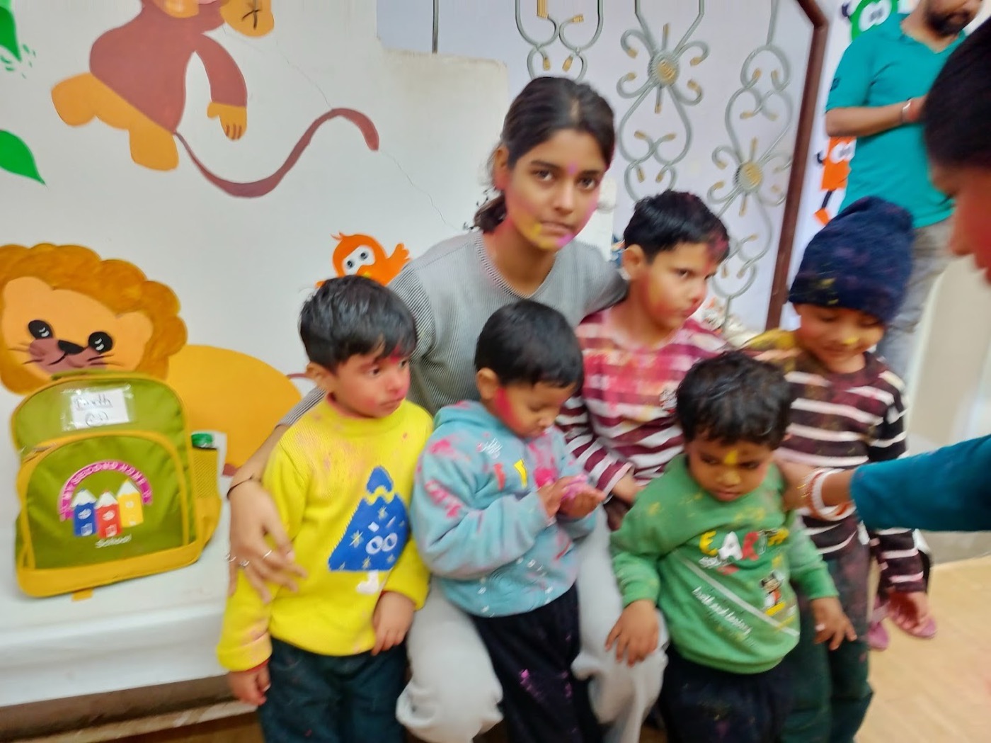 Children enjoying free play time with color powder during a festival