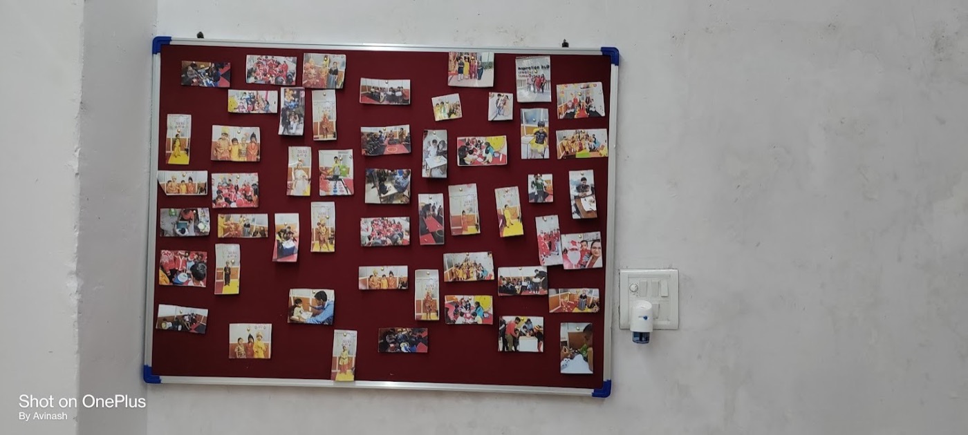 Wall display of children's learning activity photos